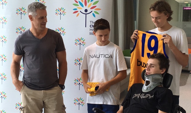 Will Murray at the Royal Children’s Hospital with father Nick and friends Luke Cleary and Josh Duscher - ${keywords}